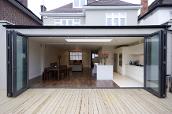 convert your old conservatory into a modern orangery, bifold doors with french doors in the centre, aluminium bifold doors, modern kitchen, orangery extension, orangery kitchen extension